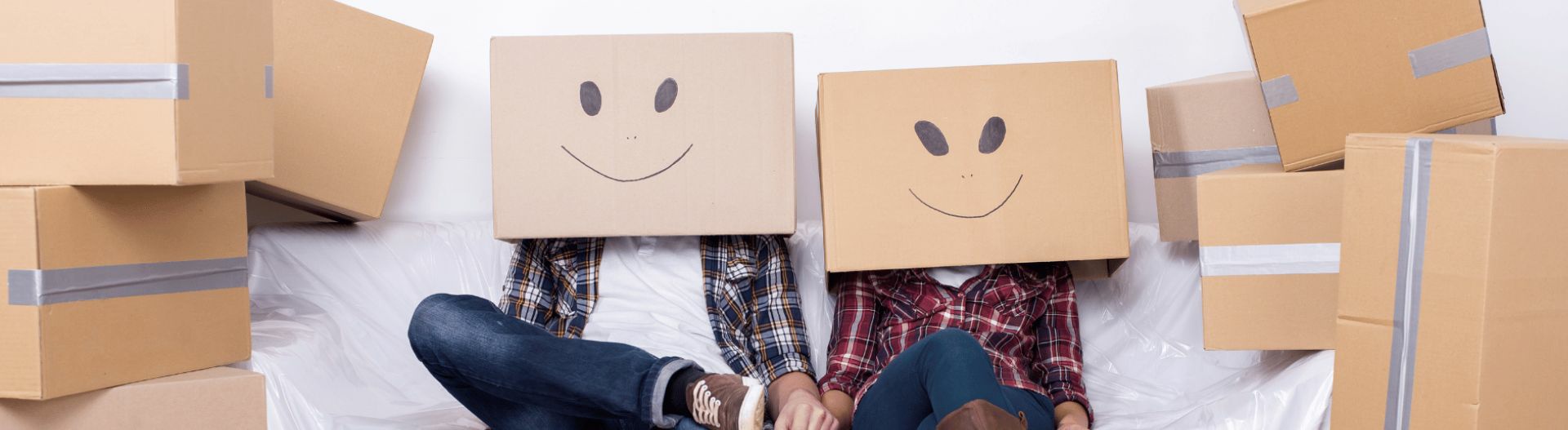 Image of two people with smiley face boxes on their heads
